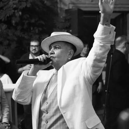 Lady Zen singing in black and white