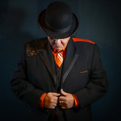 Lady Zen in studio portrait with orange tie