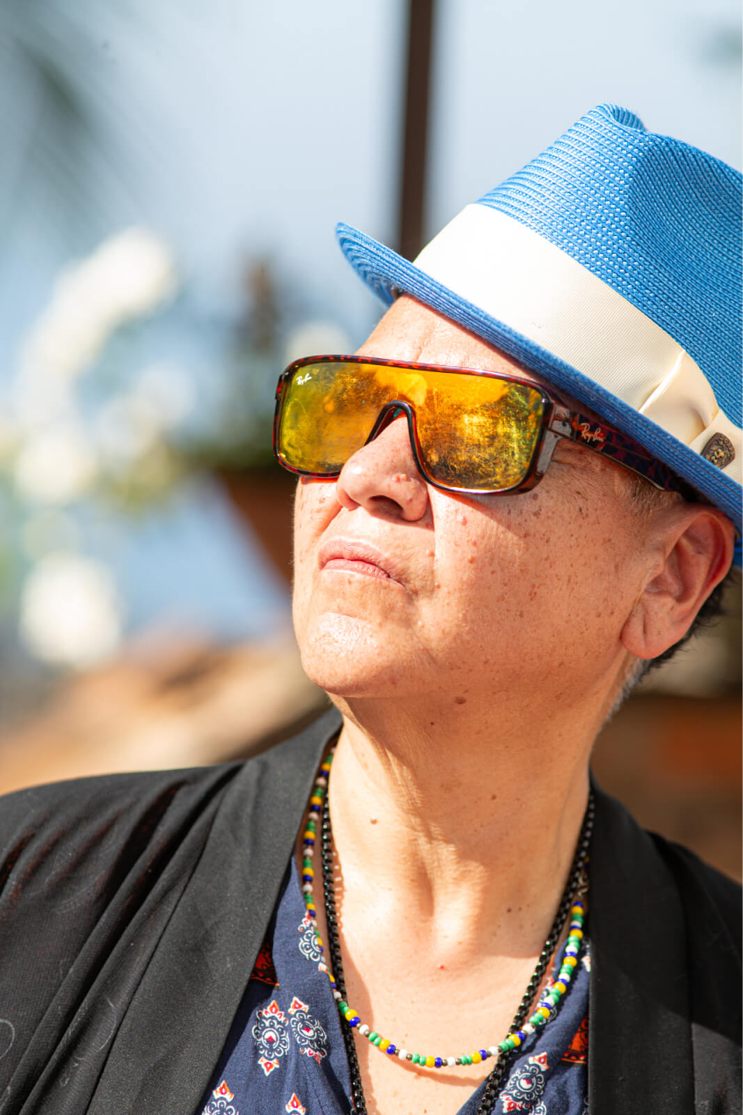 Lady Zen in blue hat and mirrored sunglasses