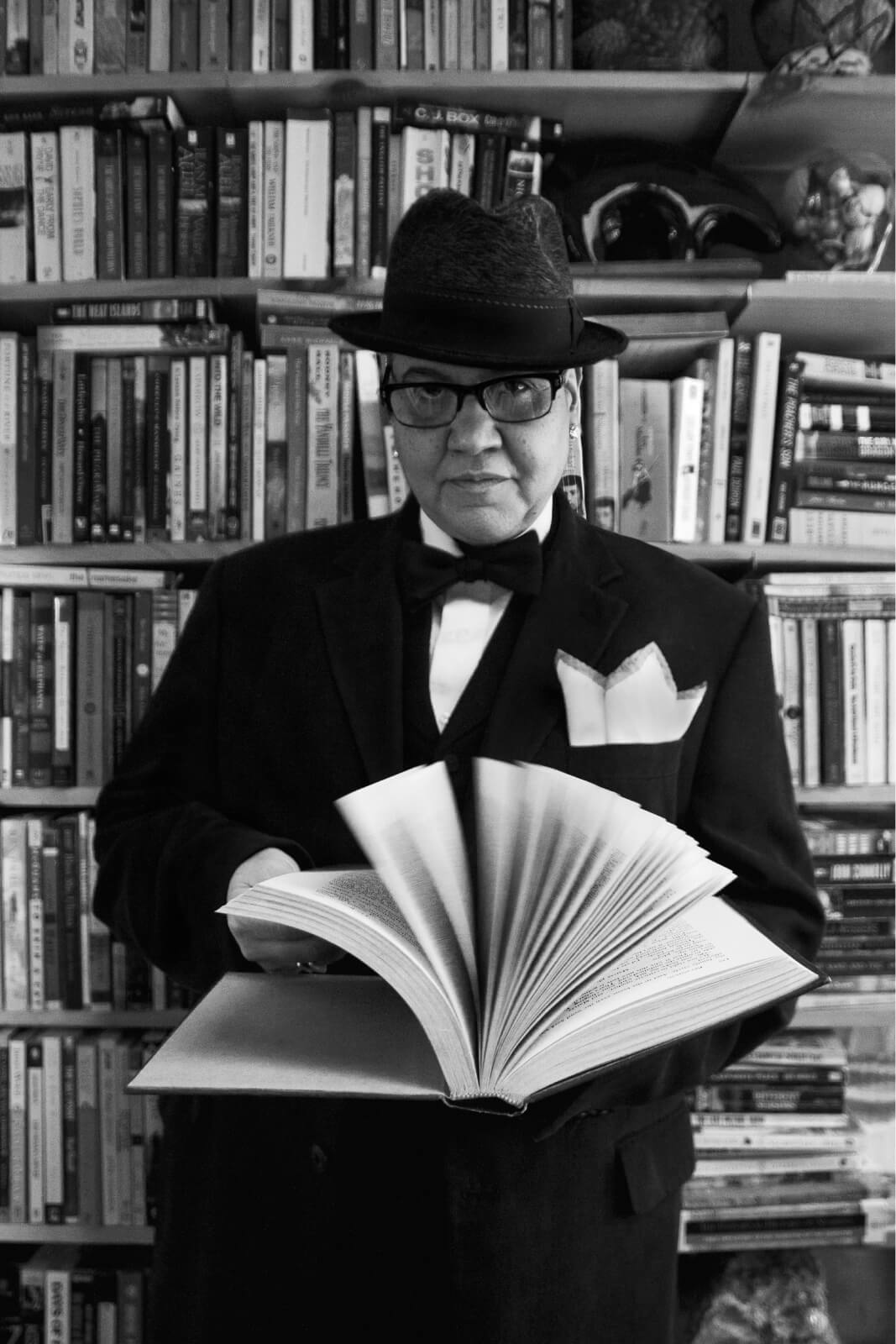 Lady Zen black and white bookshelf portrait
