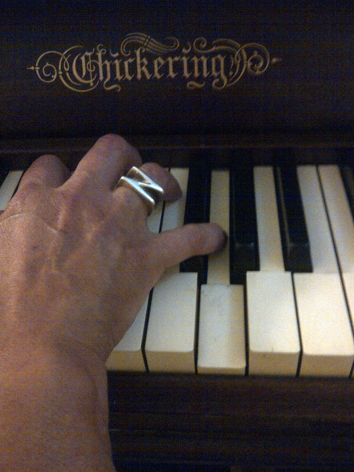 Lady Zen hand on piano keys